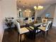 Stylish dining room featuring a glass-top table, comfortable seating, and elegant decor near the kitchen at 3235 Chutney Ct, Avondale Estates, GA 30002