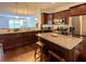 Well-equipped kitchen with granite countertops, stainless steel appliances, and dark wood cabinetry at 3235 Chutney Ct, Avondale Estates, GA 30002