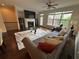 Bright living room with a fireplace, large windows, comfortable seating, and hardwood floors at 3235 Chutney Ct, Avondale Estates, GA 30002