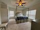 Bright bedroom with tray ceiling, canopy bed, and large windows for natural light at 3235 Chutney Ct, Avondale Estates, GA 30002