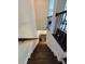 View of staircase with dark wood steps and iron railing at 3235 Chutney Ct, Avondale Estates, GA 30002