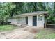 Charming single-story home with a brick foundation and a partially-wooded lot at 4009 Kirksford Dr, Decatur, GA 30035