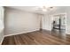 Spacious living room featuring wood flooring, neutral paint, and easy access to the kitchen at 4009 Kirksford Dr, Decatur, GA 30035