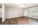 Open-concept living room featuring wood flooring, a ceiling fan, and lots of natural light at 4009 Kirksford Dr, Decatur, GA 30035