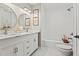 Bright bathroom featuring a double sink vanity, tub-shower combination and stylish decorative accents at 4113 Ashford Green Dr, Duluth, GA 30096