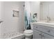 Bathroom featuring tiled walk-in shower, pebble floor, and sleek vanity at 4113 Ashford Green Dr, Duluth, GA 30096