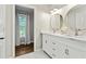 Bathroom with double sink vanity, granite countertop and marble flooring at 4113 Ashford Green Dr, Duluth, GA 30096