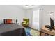 Bright bedroom with accent chair, desk, and a comfortable bed at 4113 Ashford Green Dr, Duluth, GA 30096