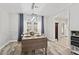 Charming dining area featuring a table set for four, wood flooring and modern lighting fixture at 4113 Ashford Green Dr, Duluth, GA 30096