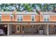 Charming brick townhome with carport parking and inviting entrance at 4113 Ashford Green Dr, Duluth, GA 30096