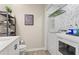 Laundry room including washer, dryer, decor and shelves at 4113 Ashford Green Dr, Duluth, GA 30096
