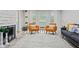 Bright living room with a stone fireplace, stylish furniture, and natural light from the large windows at 4113 Ashford Green Dr, Duluth, GA 30096