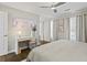 Inviting main bedroom featuring a decorative painting, desk, and bright natural light at 4113 Ashford Green Dr, Duluth, GA 30096
