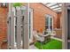 Cozy outdoor patio with seating, privacy fence, and artificial grass at 4113 Ashford Green Dr, Duluth, GA 30096