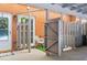 Outdoor patio with a privacy fence, small seating area and brick exterior at 4113 Ashford Green Dr, Duluth, GA 30096