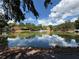 Scenic pond featuring a fountain and surrounded by lush greenery, perfect for relaxation at 4113 Ashford Green Dr, Duluth, GA 30096