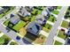 This aerial view shows a well-manicured lawn that surrounds this suburban home at 4250 Pembia Dr, Cumming, GA 30028