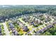 Aerial view of a suburban home with a manicured yard in a peaceful neighborhood at 4250 Pembia Dr, Cumming, GA 30028
