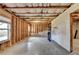 Spacious unfinished basement with exposed beams and a window, ready for customization at 4250 Pembia Dr, Cumming, GA 30028
