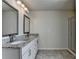 Bathroom featuring double sinks with granite countertop and modern fixtures at 4250 Pembia Dr, Cumming, GA 30028