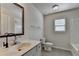 This bathroom features a framed mirror, large vanity, tile floor, and tub/shower combo at 4250 Pembia Dr, Cumming, GA 30028