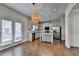 Open concept kitchen with stainless steel appliances, granite countertops, and a central island at 4250 Pembia Dr, Cumming, GA 30028