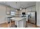 Modern kitchen featuring granite countertops, stainless steel appliances, and a center island at 4250 Pembia Dr, Cumming, GA 30028