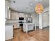 View of kitchen with stainless steel appliances, granite countertops and island at 4250 Pembia Dr, Cumming, GA 30028