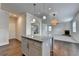 View of kitchen island, with hardwood floors and open concept floor plan at 4250 Pembia Dr, Cumming, GA 30028