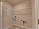 This laundry room offers tiled floors and white wire shelving for optimal organization at 4250 Pembia Dr, Cumming, GA 30028