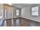 Inviting living room featuring hardwood floors, abundant natural light, and a welcoming atmosphere for comfortable living at 4250 Pembia Dr, Cumming, GA 30028
