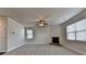 Spacious living room featuring carpet floors, crown moulding, and a fireplace at 4250 Pembia Dr, Cumming, GA 30028