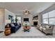 Inviting living room featuring a fireplace, large windows, and a comfortable seating arrangement at 4250 Pembia Dr, Cumming, GA 30028