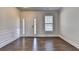 Elegant living room showcases hardwood floors, natural light, and a blank canvas ready for personalization and comfortable living at 4250 Pembia Dr, Cumming, GA 30028