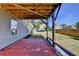 A patio with brick flooring that offers a view of the manicured, fenced backyard at 4250 Pembia Dr, Cumming, GA 30028