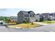 View of the home from the street showing the front yard, driveway, and surrounding neighborhood at 4250 Pembia Dr, Cumming, GA 30028