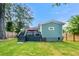 Well-maintained backyard with a deck, lush green lawn, and privacy fence at 853 Gaston Sw St, Atlanta, GA 30310