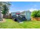 Exterior view of the home showcasing a well-kept backyard with a deck and green space at 853 Gaston Sw St, Atlanta, GA 30310