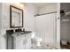 Bright bathroom with patterned tile floor, storage shelves, and a shower curtain, offering style and functionality at 853 Gaston Sw St, Atlanta, GA 30310