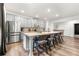 Stylish kitchen island with barstool seating, modern appliances, and ample cabinet space at 853 Gaston Sw St, Atlanta, GA 30310