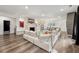 Open floor plan showcasing living room with hardwood floors, fireplace, and access to the dining area at 853 Gaston Sw St, Atlanta, GA 30310