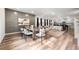 Open-concept living and dining area featuring hardwood floors and large windows at 853 Gaston Sw St, Atlanta, GA 30310