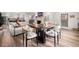 Bright and airy living area with hardwood floors, an open floorplan, and a cozy fireplace at 853 Gaston Sw St, Atlanta, GA 30310