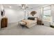 Spacious and serene primary bedroom with stylish accents, plush carpeting, and large windows at 853 Gaston Sw St, Atlanta, GA 30310