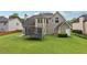 The backyard is spacious with a lush lawn and mature trees; ideal for outdoor living at 2009 Mclain Nw Rd, Acworth, GA 30101