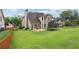 Spacious backyard with lush lawn, patio, and ample space for outdoor activities and relaxation at 2009 Mclain Nw Rd, Acworth, GA 30101