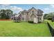 A spacious backyard with a lush lawn and mature trees offers plenty of room for recreation at 2009 Mclain Nw Rd, Acworth, GA 30101