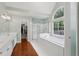 The primary bathroom features double sinks, a soaking tub, and a glass shower at 2009 Mclain Nw Rd, Acworth, GA 30101