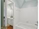 Bright white bathroom with shower and tub combination at 2009 Mclain Nw Rd, Acworth, GA 30101