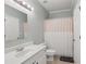 Bathroom with white vanity, tile floors and shower with tub at 2009 Mclain Nw Rd, Acworth, GA 30101